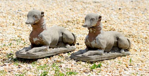 PAIR OF ENGLISH CAST STONE RECUMBENT WHIPPETS