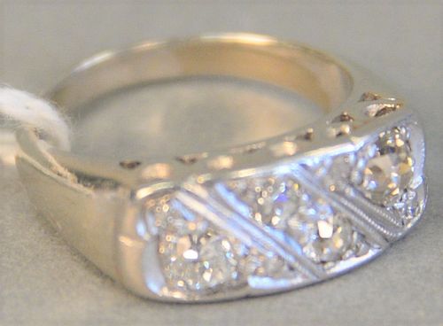 14k white gold ring set with eight diamonds, 4.4 gr., size 5.