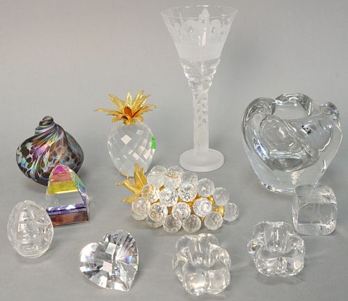 Eleven pieces of crystal and glass, including: Swarovski crystal grapes and pineapple; Faberge crystal egg; Baccarat dice, Daum low vase; two salts, a