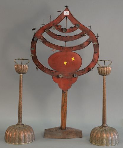Three pricket candle holders including: a pair of metal single pricket candle holders with chrysanthemum motif, domed base, tapered shaft and scallope