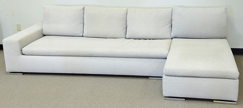 Minotti two-part sectional sofa, cream upholstery, on chrome feet, 112" l.