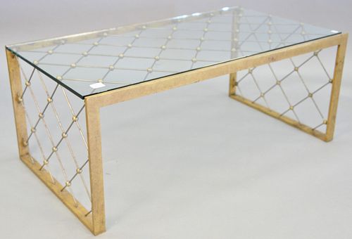 Jean Royere style glass top coffee table, 20th C., gilt metal frame, metal and ball lattice design, light wear, loss and scratches, 18" h. x 24" w. x 