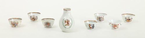GROUP OF SEVEN CHINESE EXPORT ARMORIAL TEA BOWLS AND A CHINESE EXPORT PORCELAIN CREAM JUG