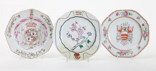 TWO CHINESE EXPORT FAMILLE ROSE ARMORIAL PORCELAIN OCTAGONAL PLATES AND A CIRCULAR PLATE