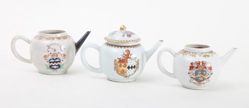 CHINESE EXPORT FAMILE ROSE ARMORIAL PORCELAIN TEAPOT AND COVER AND TWO TEAPOTS