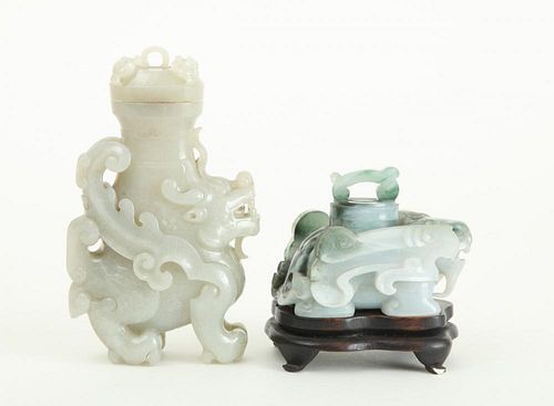 TWO CHINESE CARVED JADE ARCHAIC STYLE BUDDHISTIC DOG-FORM VESSELS AND COVERS