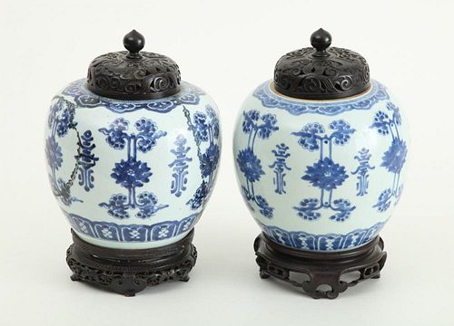 ASSEMBLED PAIR OF CHINESE BLUE AND WHITE PORCELAIN GINGER JARS AND PIERCED HARDWOOD COVERS