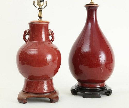 TWO CHINESE OX BLOOD-GLAZED PORCELAIN VASES, MOUNTED AS LAMPS