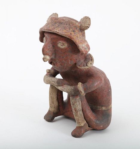 NAYARIT TYPE POLYCHROME POTTERY FIGURE OF A SEATED MAN