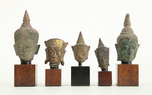 GROUP OF FIVE SOUTHEAST ASIAN BRONZE HEADS OF BUDDHA