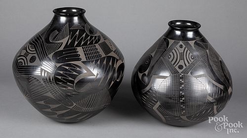 Contemporary black on black pottery vessels