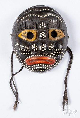 Carved and painted tribal mask