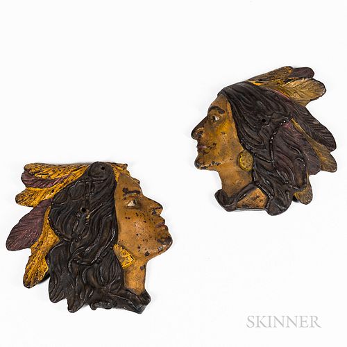 Two Painted Cast Iron Indian Head Plaques