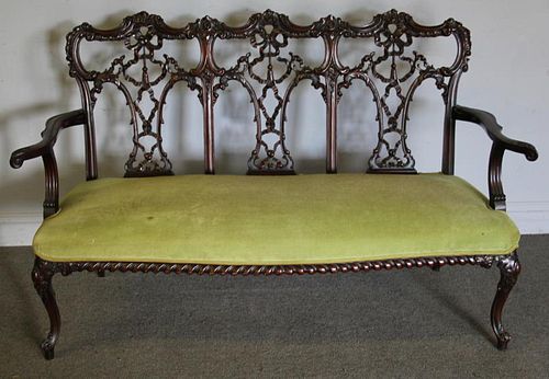 Finely Carved and Upholstered Mahogany Loveseat.