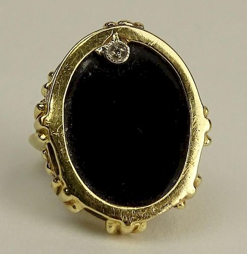Lady's Vintage 14 Karat Yellow Gold and Black Onyx Ring with small accent Diamond