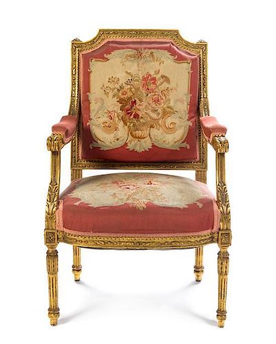 A Louis XVI Style Tapestry Upholstered Giltwood Fauteuil Height 38 3/4 inches.