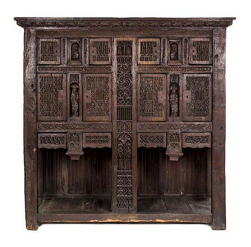 A Gothic Oak Sacristy Cabinet Height 77 1/2 x width 79 x depth 23 inches.