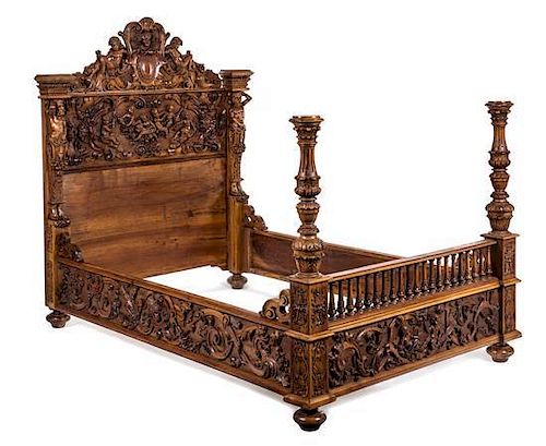 A Renaissance Revival Carved Oak Bed Height 69 1/4 x width 59 1/2 inches.
