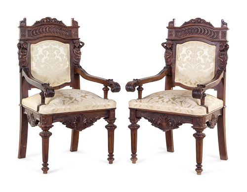 A Pair of French Renaissance Revival Carved Walnut Armchairs