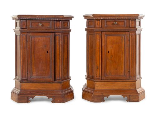 A Pair of North Italian Carved and Paneled Walnut Cabinets