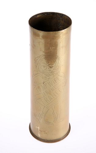 A WORLD WAR I TRENCH ART BRASS SHELL, dated 1916, engraved with a lion hold