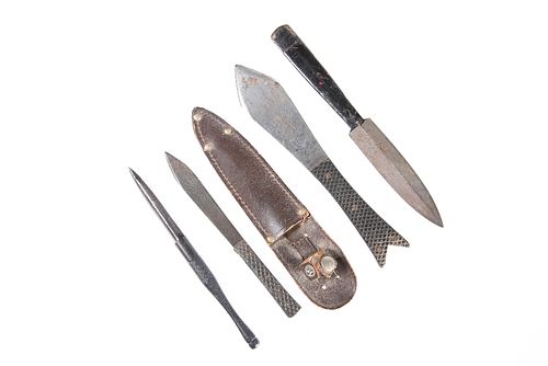 A GROUP OF FOUR THROWING KNIVES, including three World War II period.