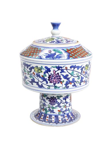 A CHINESE DOUCAI PORCELAIN STEM JAR AND COVER, decorated in underglaze and 