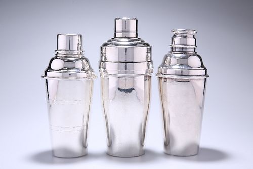 THREE SILVER-PLATED COCKTAIL SHAKERS, in the Art Deco taste, each of charac