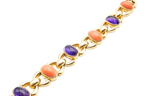 AN AMETHYST AND CORAL BRACELET, BY CARTIER 
 Alternately set with cabochon 