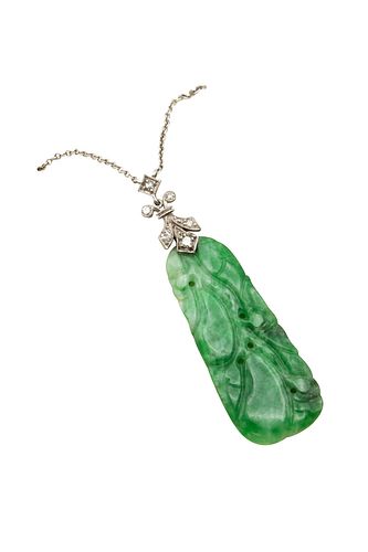 A JADEITE AND DIAMOND PENDANT NECKLACE 
 The carved jadeite plaque, to a di