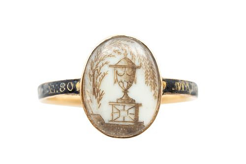 A HAIRWORK AND ENAMEL MOURNING RING, CIRCA 1780
 The glazed oval compartmen