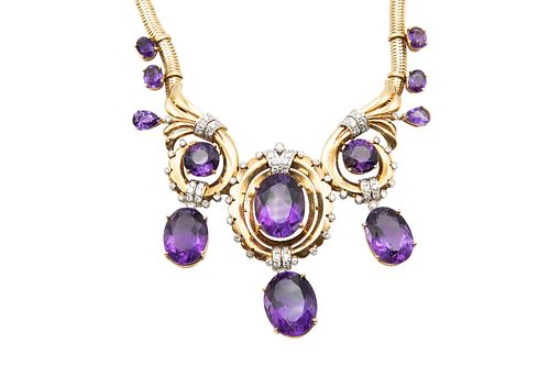 AN AMETHYST AND DIAMOND NECKLACE
 The central pendant set with an oval-shap