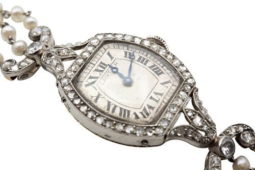 AN EARLY 20TH CENTURY SEED PEARL AND DIAMOND BRACELET WATCH, BY CARTIER
 Th