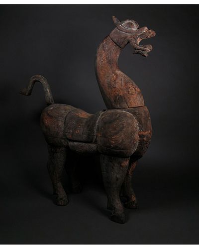 A LARGE WOOD FIGURE OF A HORSE