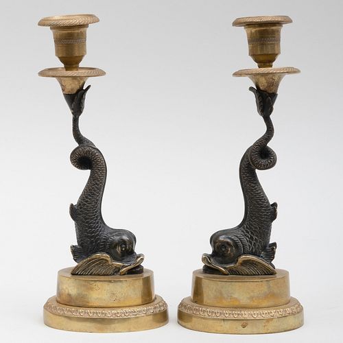 Pair of Regency Bronze and Parcel-Gilt Dolphin Form Candlesticks