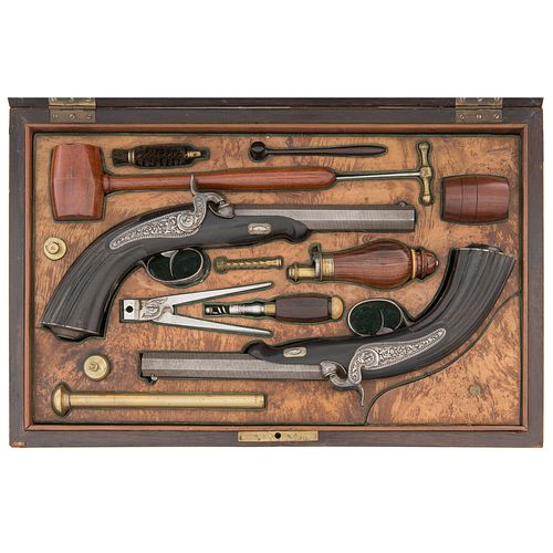 A Fine Cased Set of Ebony Stocked Continental Dueling Pistols with Unusually Fine Accessories