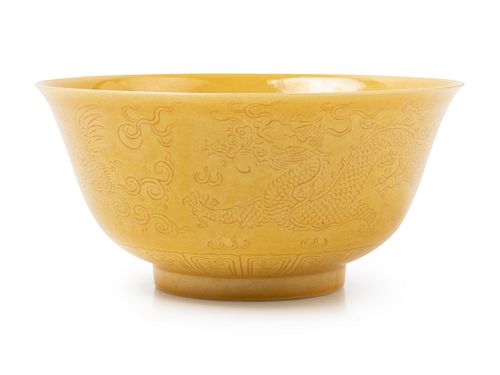 An Incised Yellow Glazed Porcelain 'Dragon and Phoenix' BowlDiam 5 1/2 in., 13.97 cm.