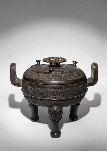 An Rare Archaistic Bronze Ritual Tripod Vessel and Cover, Ding
Height 12 1/4 x length 15 3/4 x diam 12 in., 31 x 40 x 30 cm. 