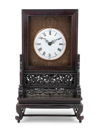 A Hardwood Mantel Clock
Height overall 25 1/4 in., 64 cm.
