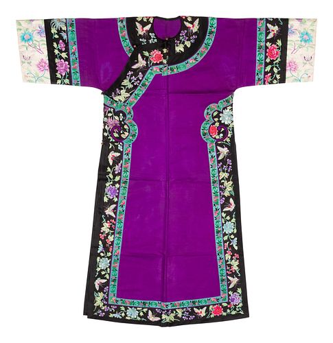 A Purple Ground Embroidered Silk Manchu Lady's Informal RobeLength 56 in., 142 cm.