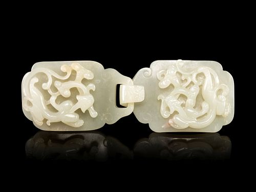 A Carved White Jade 'Chilong' Belt Buckle Length overall 5 1/2 in., 14 cm.