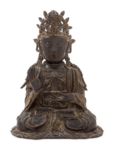 A Bronze Figure of Seated GuanyinHeight 12 1/4 inches, 31 cm.