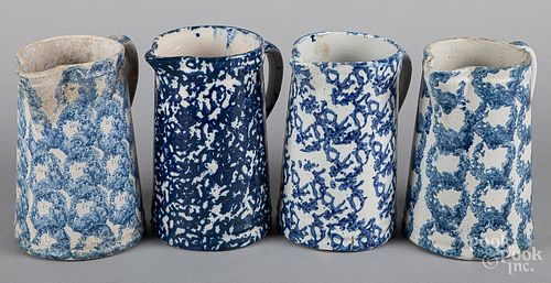 Four blue spongeware pitchers, 19th c.