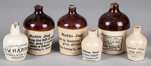 Six miniature stoneware advertising jugs