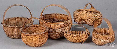 Six small woven baskets