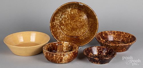 Four Rockingham and yellowware bowls, etc.