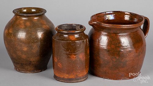 Redware pitcher, together with two crocks 19th c.
