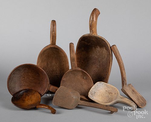 Collection of wooden scoops and butter paddles