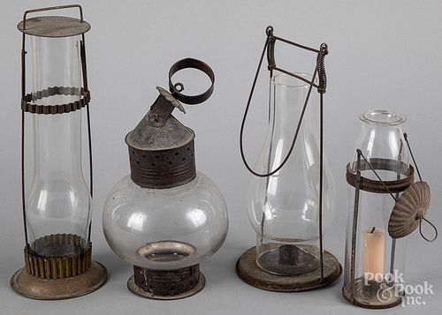 Four tin and glass carry lanterns, 19th c.