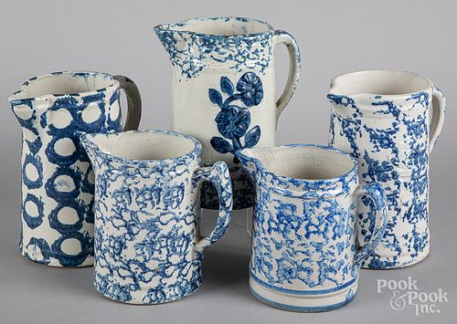 Five sponge decorated stoneware pitchers